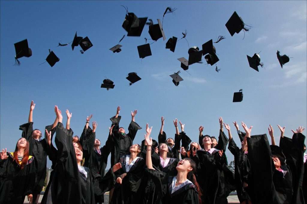 Young adults celebrating graduating from college